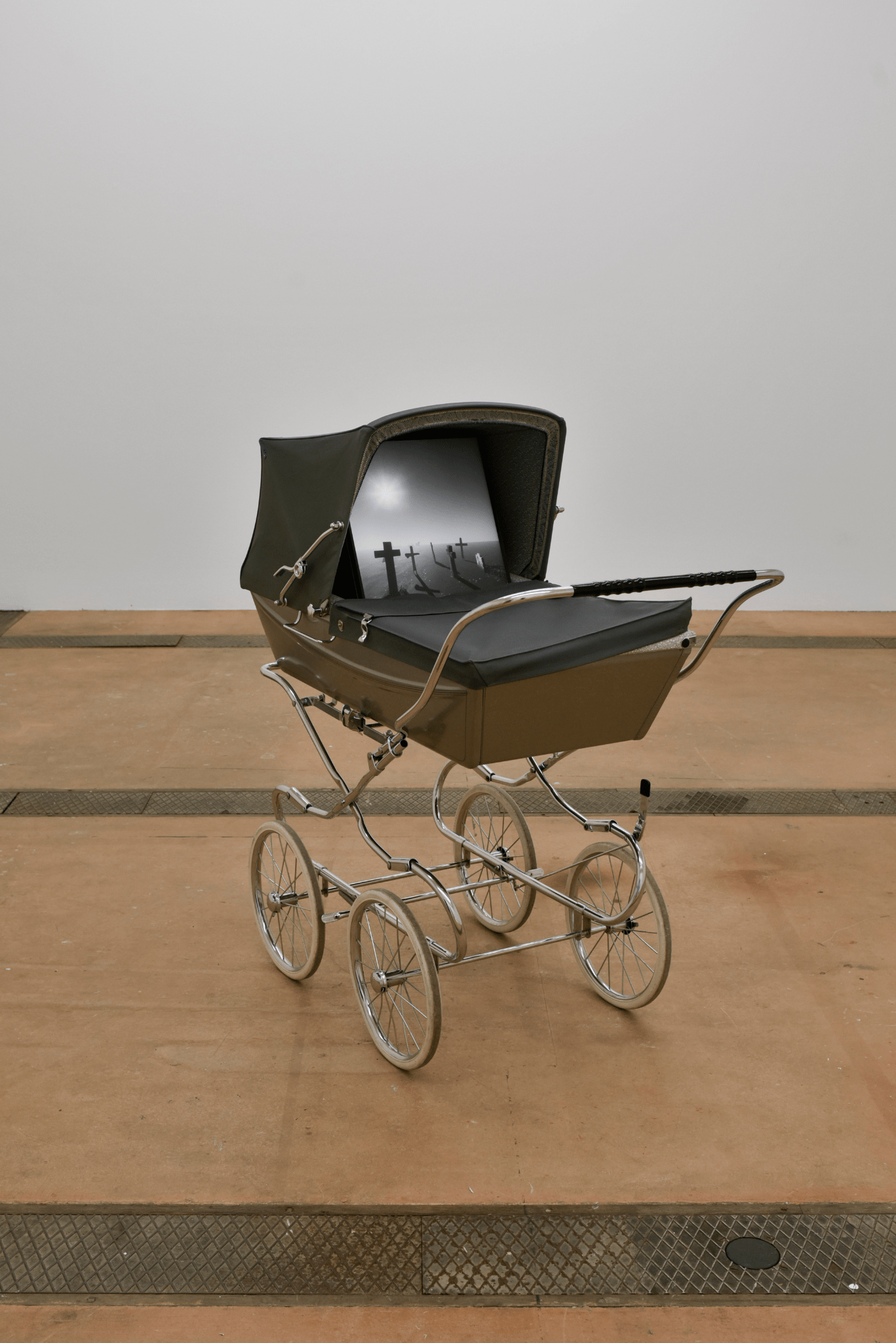 Alfatih, A Way Out of Time, 2024 Pram, real-time video of variable duration, full-time gallery attendant Soundtrack by Tapiwa Svosve Courtesy of the artist & Centre d’Art Contemporain Genève for BIM’24 Exhibition view of the Biennale de l’Image en Mouvement 2024, A Cosmic Movie Camera, at Centre d’Art Contemporain Genève. Photo: Mathilda Olmi © Centre d’Art contemporain Genève